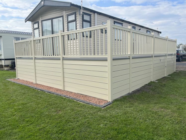 Cream holiday home with handrail and horizontal skirting